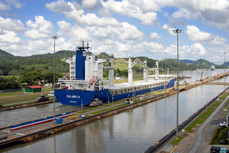 PANAMA – SEPTEMBER 10. Cargo ship crosses locks on September 10, 2006 in Panama Canal. With its...