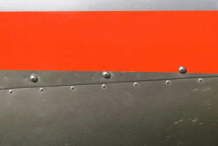 Red and silvel metal texture with rivets and screws  Useful as background for design works 