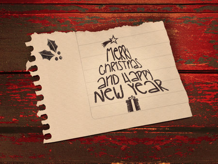Vintage Merry Christmas and happy new year message in paper note over wooden background. 
