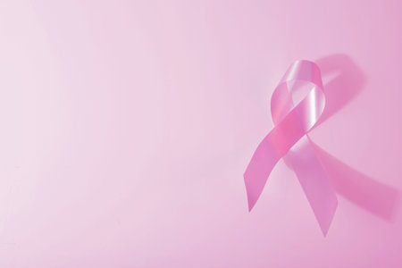 Breast cancer awareness pink ribbon and background. Ideal for social media campaign or web.