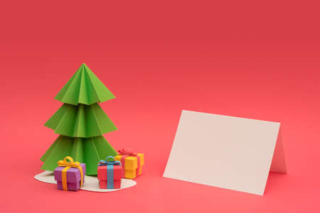 Christmas season paper cut design: 3d handmade xmas pine tree, gift boxes and empty greeting card template with clipping path. Ideal for holiday project.の写真素材