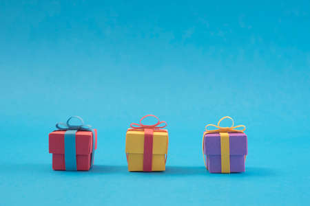 Concept handmade paper cut holiday gift boxes. Ideal for christmas greeting card, campaign, poster or web.の写真素材