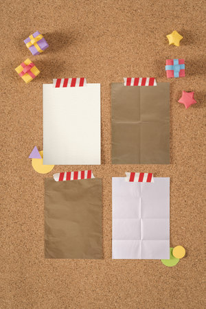 Paper texture notes template on cork notice board background with colorful cute handmade elements, including clipping path. Ideal for design mock up portfolio, school, office or stationery.の写真素材