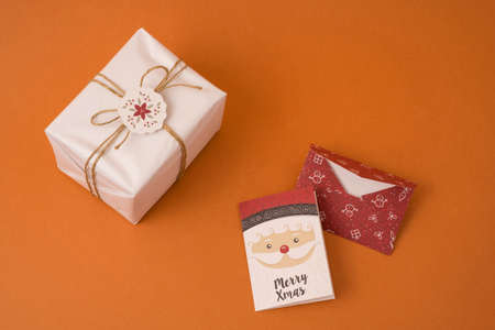 Merry Christmas top view scene composition with rustic vintage gift box, label and holiday greeting card.の写真素材