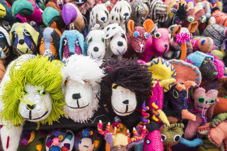 Close up of colorful animal handmade toy souvenirs in display at mexican street market.の写真素材
