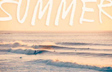 Summer typography on vintage sea landscape. People surfing on the beach surf background.の写真素材