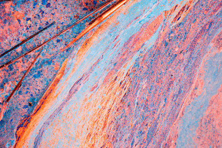 Colorful liquid paint background in high contrast rainbow colors, abstract texture art backdrop.の写真素材