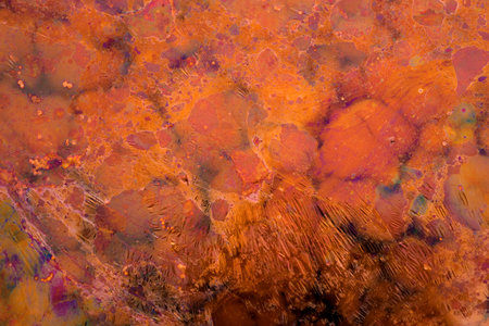 Grunge background in vibrant contrast color. Abstract art texture backdrop of red liquid.