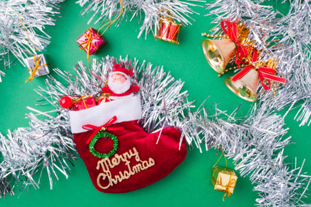 Christmas decoration objects on light green background