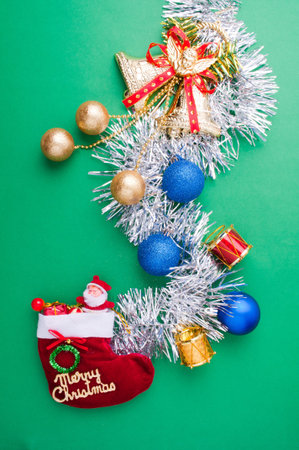 Christmas decoration objects on light green backgroundの写真素材