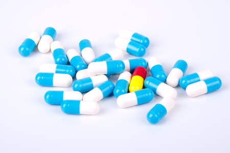 medicine capsules blue and white on white backgroundの写真素材