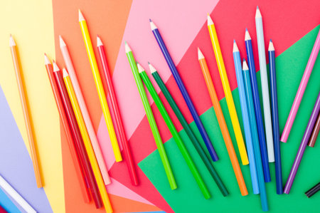 school supplies with leaves and colored pencilsの写真素材