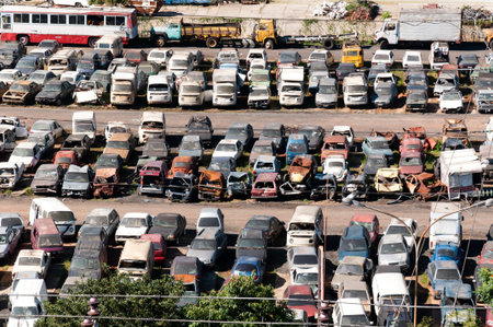 Junkyard with cars abandoned and rusting