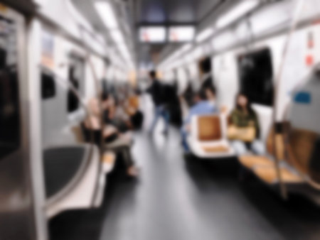 People inside the train wagon at subway station. Intentional blurred added post production. Creative abstract background with blurred in modern style.の写真素材