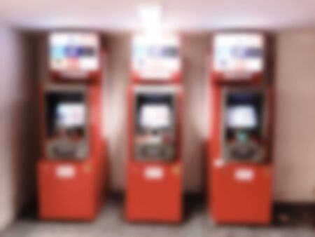 ATM machine in shopping mall. Intentional blurred added post production. Creative abstract background with blurred in modern style.の写真素材