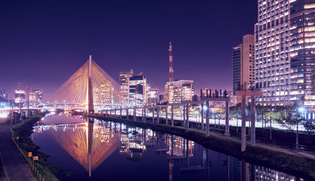 An urban cityscape with the cable-stayed bridge, modern buildings, Marginal Pinheiros, and Pinheiros...