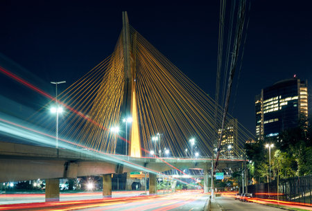 Urban night cityscape with a cable-stayed bridge, and modern buildings in the city of SÃ£o Paulo.の写真素材