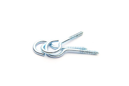 Small silver screws on pure white backgroundの写真素材