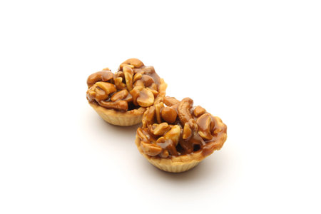 Chocolate biscuit with Cashew nuts on white backgroundの写真素材