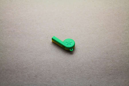 Whistle isolated on seamless brown paper の写真素材