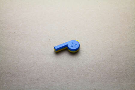 Whistle isolated on seamless brown paper の写真素材