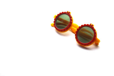 Old children sunglasses isolated on white の写真素材