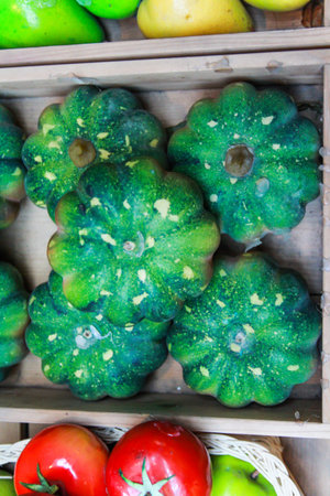 Green pumpkins in a basketの写真素材