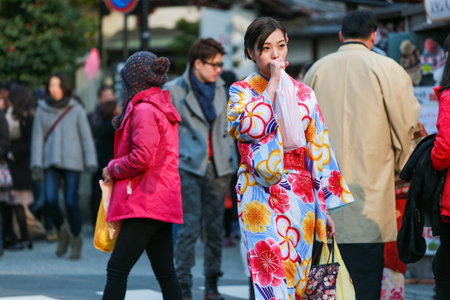 Kyoto, Japan - FEBUARY 10 2015: Pretty girl wearing Japanese kimono at Kiyomizu-dera Temple in...