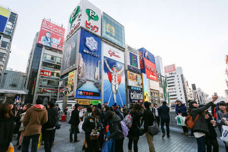 OSAKA, JAPAN - FEBUARY 11: The Glico Man light billboard and other light on Febuary 11 2015 in Dontonbori, Namba area, Osaka, Japan. Namba is now primary tourist destination.のeditorial素材
