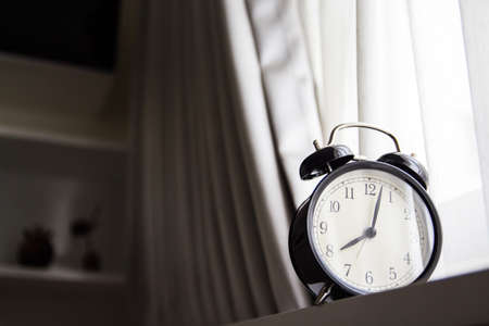Alarm clock with wall on backgroundの写真素材