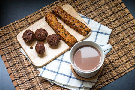 Chocolate chip stick bread with muffin on A cutting board