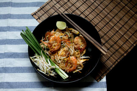 Pad Thai with wooden texture on backgroundの写真素材