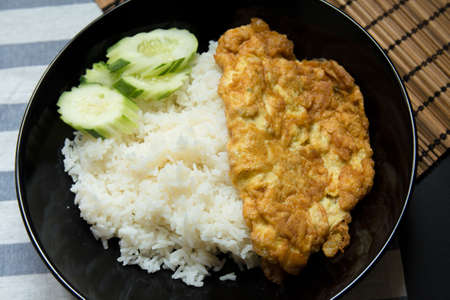 Omelet with rice on a table.の写真素材