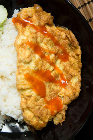 Omelet with rice on a table.の写真素材