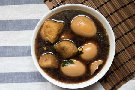 Eggs and tofu with sweet brown sauceの写真素材