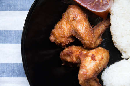 Roasted chicken wings with sticky riceの写真素材