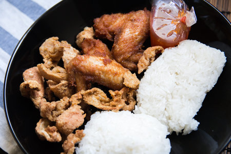 Roasted chicken wings with sticky riceの写真素材