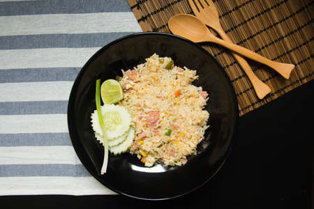 Pork fried rice with cucumber and onionの写真素材