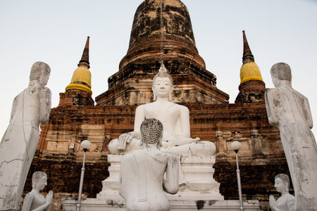 Buddha Statues with pagoda behind in Wat Mahathat, Ayutthaya Thailand