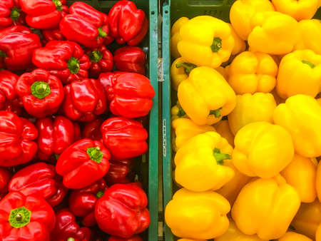 Pile of yellow and red pepperの写真素材