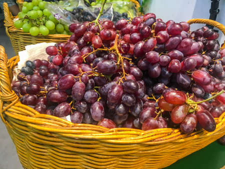 Pile of sweet grape on a basket ,shot in supermarketの写真素材