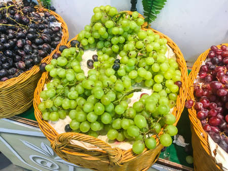 Pile of sweet grape on a basket ,shot in supermarketの写真素材