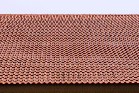 view of roof against blue sky