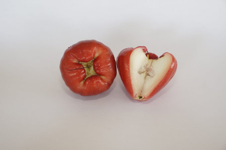 red rose apple fruits on white background