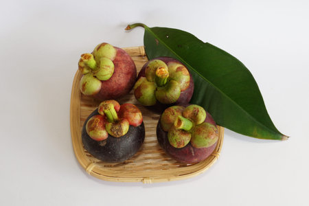 fresh mangosteen fruits isolated on white background