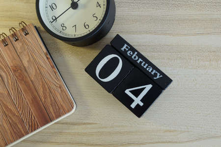 cube calendar on the wooden backgroundの写真素材
