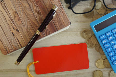 coins with note book and calculator on the table. Business conceptの写真素材