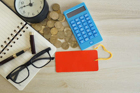 coins with note book and calculator on the table. Business conceptの写真素材