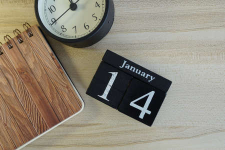 cube calendar on the wooden backgroundの写真素材