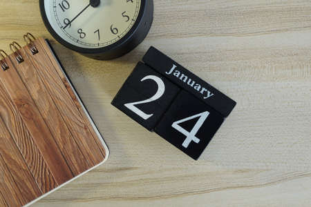 cube calendar on the wooden backgroundの写真素材